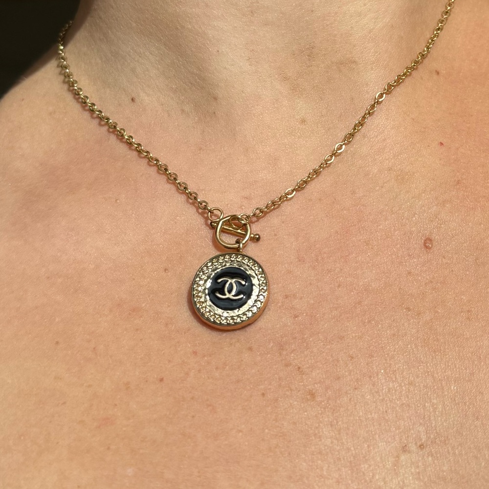 Authentic Chanel button repurposed into a necklace by local costume designer